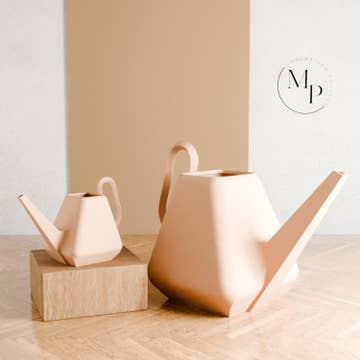 two geometric watering cans of different sizes
