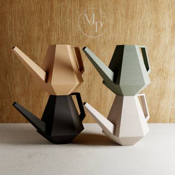4 watering cans all different colours stacked on top of each other