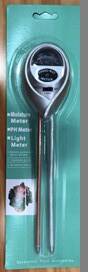 A packaged 3-in-1 moisture, light, and pH meter with a digital display, accompanied by a product image showing the device itself with a silver color and a green and white color scheme on the packaging.