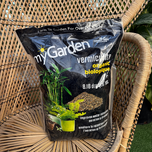 a black back labelled my garden vermiculite organic with images of plants on the package with the bag resting on a wicker chair