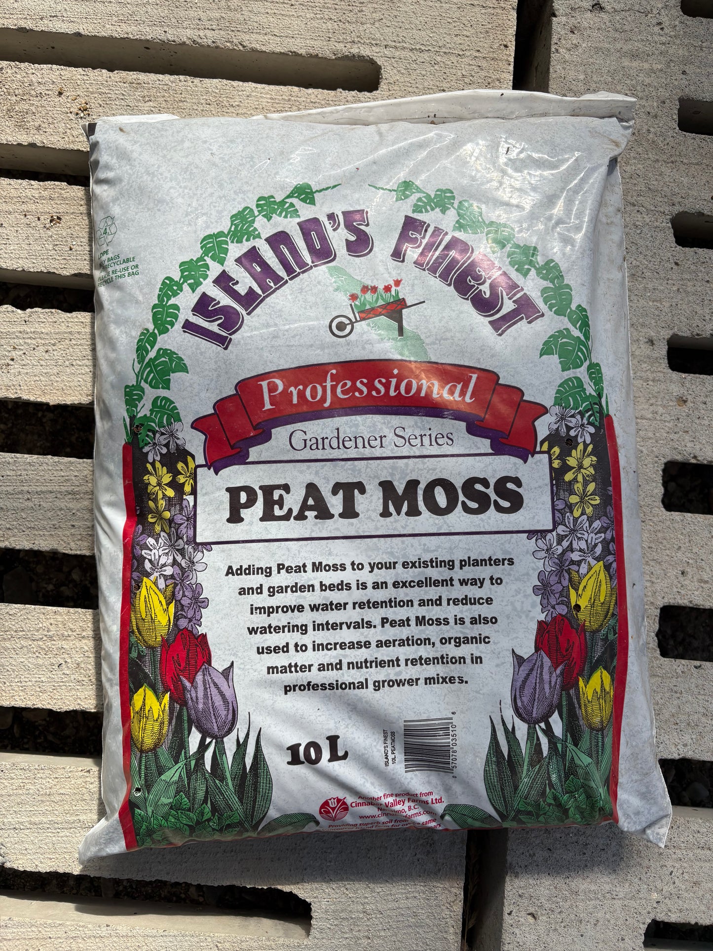 a white bag of peat moss on a concrete surface