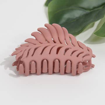 a pink plant themed air-clip-against a white background