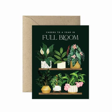 a black plant themed card that says cheers to a year in full bloom on a white background