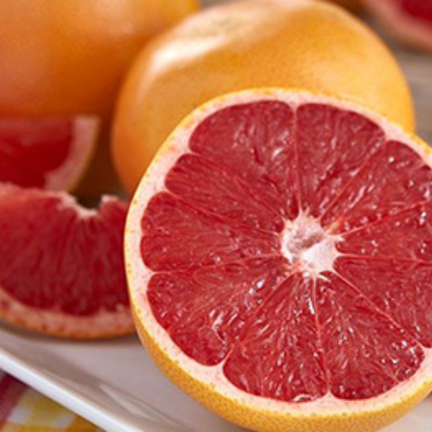 a close up of a ruby red grapefruit