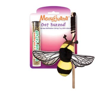 A refillable catnip toy shaped like a bee with a compartment for refilling, packaged on a pink and purple cardboard backing.