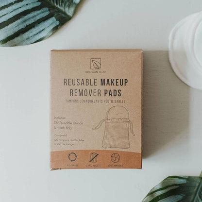 A cardboard box labeled 'Reusable Makeup Remover Pads' by Urban Eight, with an illustration of a makeup bag on the front, placed on a white surface.
