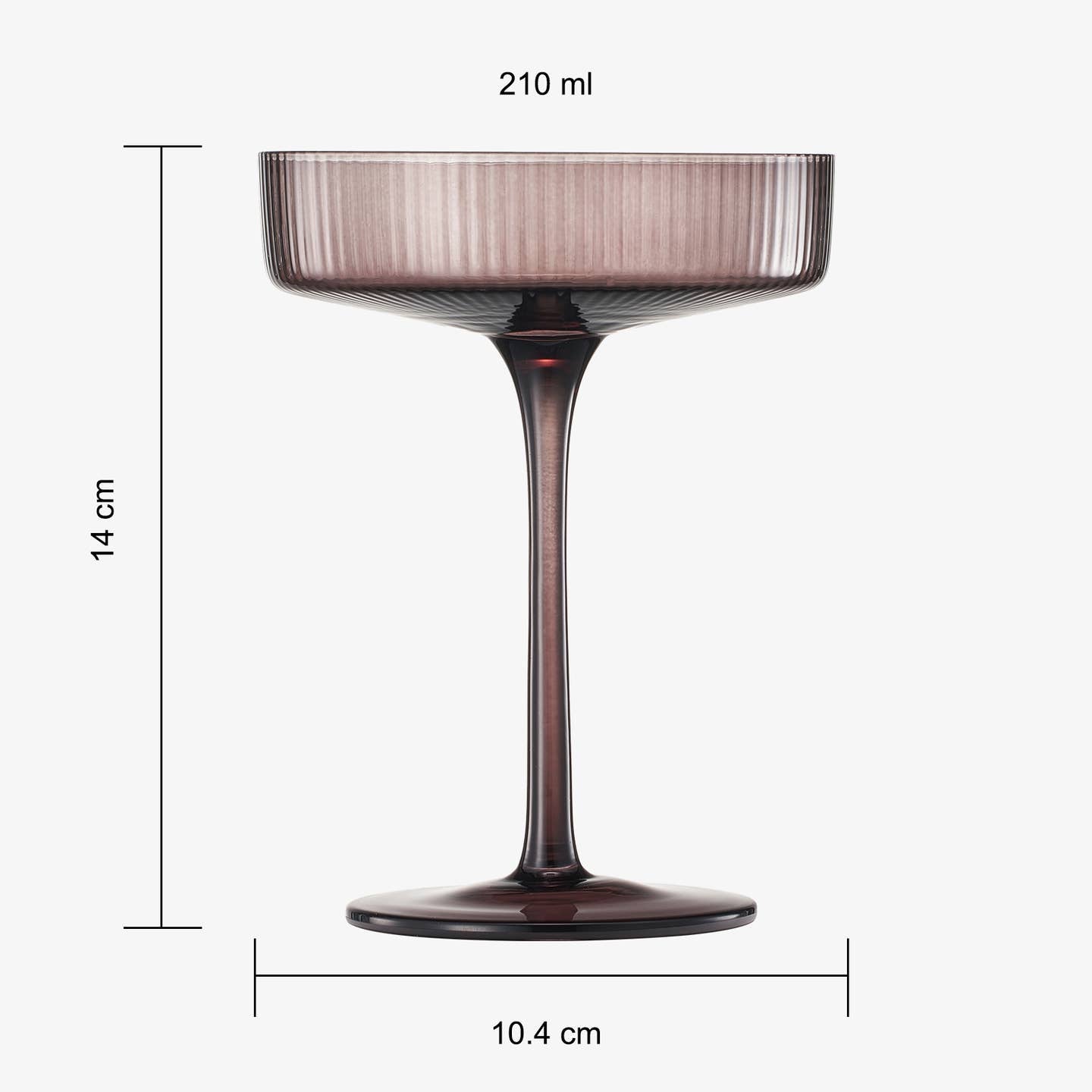 a brown coloured ribbed champagne glass against a plain white background