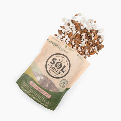 a tan bag of sol soils orchid chunky mix laying down with its contents spilled onto the white background