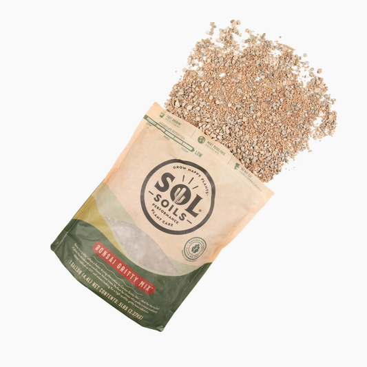 a tan bag of sol soils bonsai gritty mix laying down with its contents spilled onto the white background