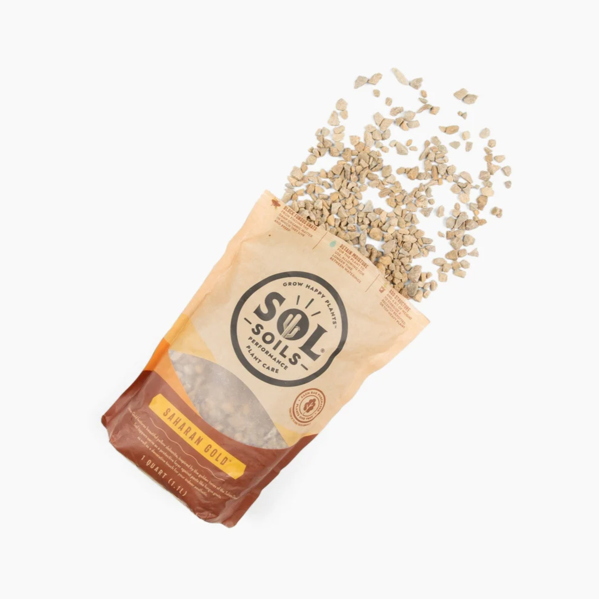 a tan bag of sol soils saharan gold soil topper laying down with its gravel like content spilled onto the white background