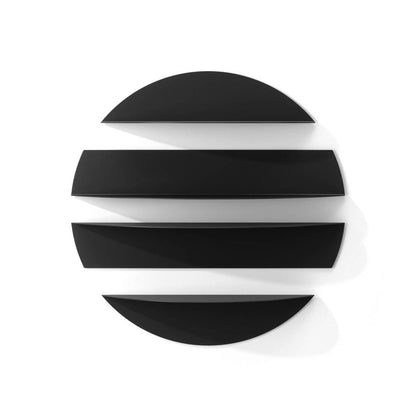 A set of four black and white Solis wall shelves mounted on a wall, with a circular design where two large shelves are accompanied by two smaller ones, allowing for versatile arrangement.