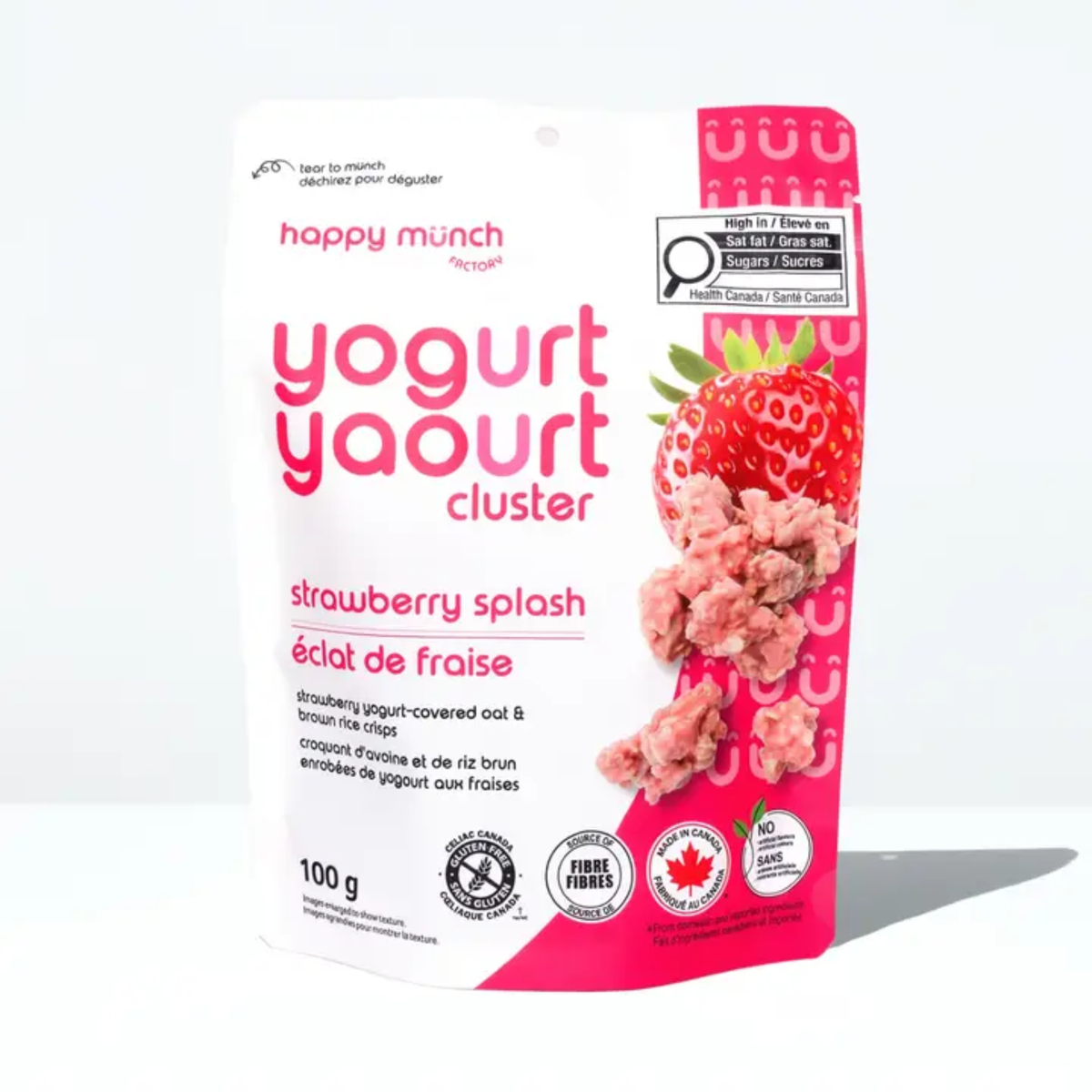 a package with an pink side of happy munch yogurt clusters strawberry splash with an image of a strawberry and clusters against a white background