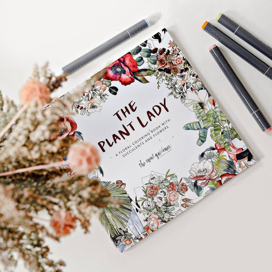 a colouring book titles the plant lade, white in colour with colourful floral borders