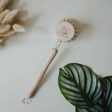 round bristle brush with long wooden handle with white background