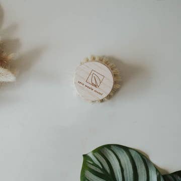 round wooden bristle brush scrubber with white background