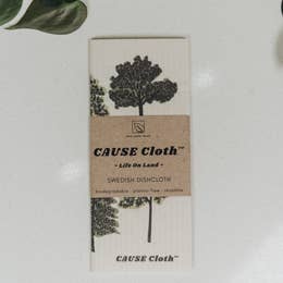 folded cloth with tree pattern wrapped with branding titled cause cloth